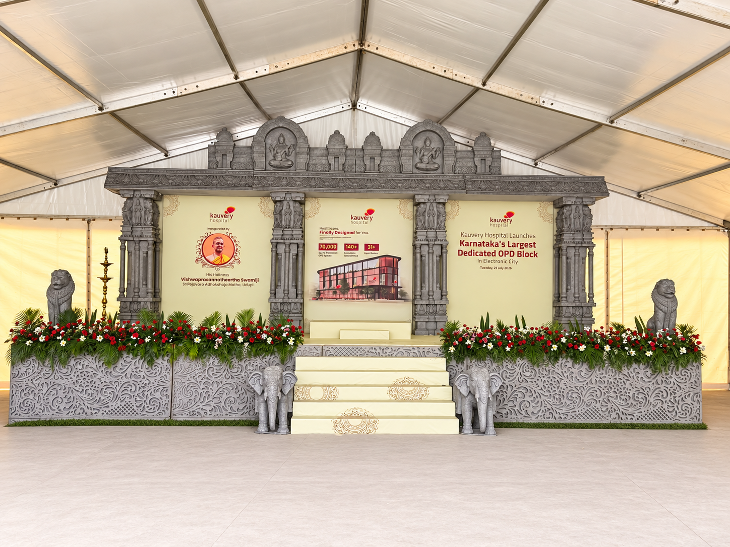 Temple-inspired inauguration stage with floral arrangements